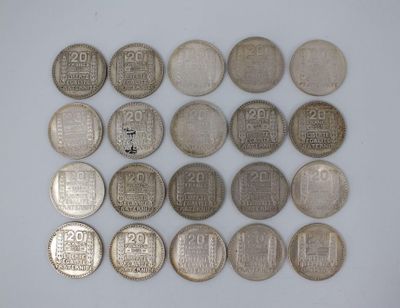 several different types of chinese coins on a white surface