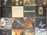 a lot of different album covers on the wall