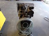 a machine that is sitting on a cart in a garage