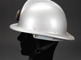 a close up of a white hard hat on a mannequin head