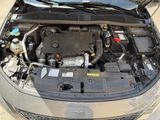 a car with its hood open and the engine in the back