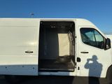 a white van with its door open in a parking lot