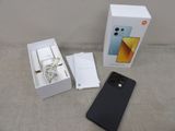 an image of a box with a phone in it and a charger attached to it