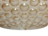 an image of a white glass bowl with bubbles on it