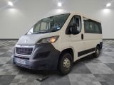 a picture of a white van parked in a large room