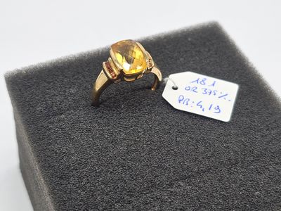 an image of a gold ring with a citrine stone in it