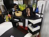 a desk with a chair and a table with a cake on it
