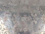 a silver tray with a floral design on it