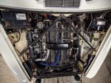 a picture of the engine of a car that is under the hood