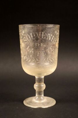 a glass cup that is sitting on a table