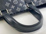 a black purse with a silver pattern on it