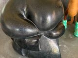 a statue of a dog that is sitting on a counter