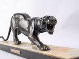 an image of a bronze statue of a tiger on a marble base