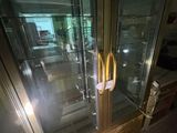 a glass door with a handle in the middle of the room