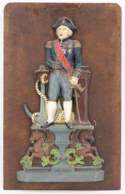 a statue of a man in a military uniform on a pedestal