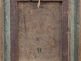 an old picture frame hanging on a wall with a rope