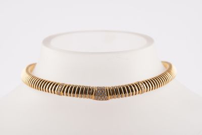 a close up of a necklace on a mannequin mannequin
