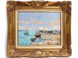 tableau représentant des bateaux sur la plage, dans un cadre doré