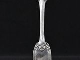a silver spoon with a handle on a black background