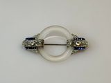 a white ring with blue and white stones on it