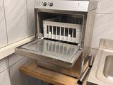 a toaster that is on a counter in a kitchen