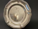 a silver plate that is sitting on a table