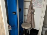 a blue locker next to a toilet in a bathroom