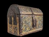 an old wooden chest with a decorative design on it
