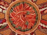 a painting of a plate with peppers and other vegetables on it