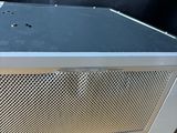 a metal box that is on a wooden table