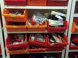 many bins of assorted items on a shelf