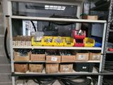 many boxes of assorted items on a shelf
