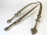pair of silver - plated swords, probably from the late 19th century, in the form of a bow