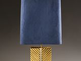 a gold and blue lamp with a blue shade on it