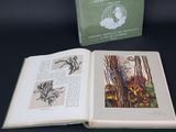 a book opened to show a picture of a bird in a cage