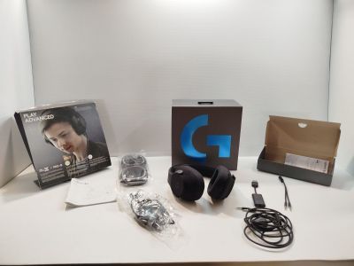 a table with headphones and a box on top of it