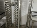 a metal rack that has a bunch of trays on it