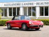 a red sports car parked in front of a building