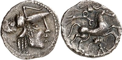 a silver coin with an image of a man riding a horse