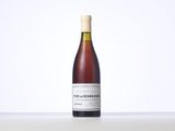 a bottle of wine that is sitting on a table
