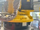 a man that is working on a machine in a factory