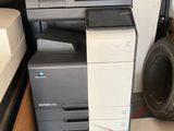 a pile of office equipment in the back of a van