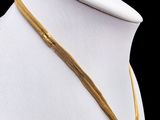a gold necklace on a mannequin mannequin mannequin mannequin mannequin mannequin mannequin mannequin mannequin