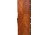 a tall wooden cabinet with drawers on top of it