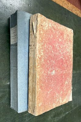 an old book on the wall next to a blackboard