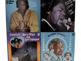 three vinyl albums of various black and white music, including one with a microphone and one with a microphone