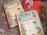 several children ' s books are lined up on the floor