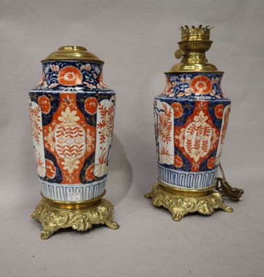 pair of antique chinese vases on stands on a white background