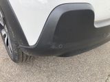 a close up of a car ' s rear bumper