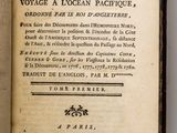 an open book with a black and white title on it